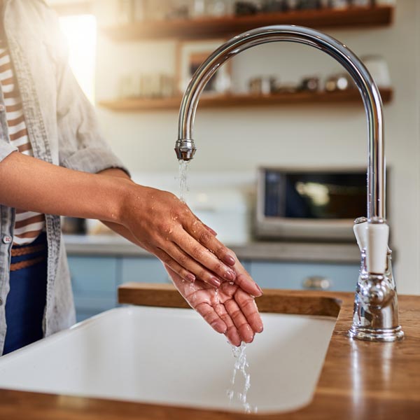 washing hands in sink