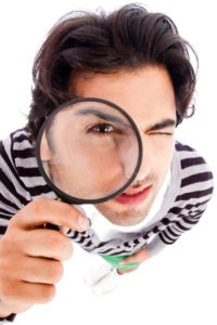 Man looking through a glass