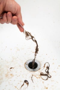 Man doing drain cleaning